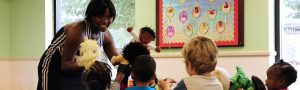 Young woman playing with children in an educational setting