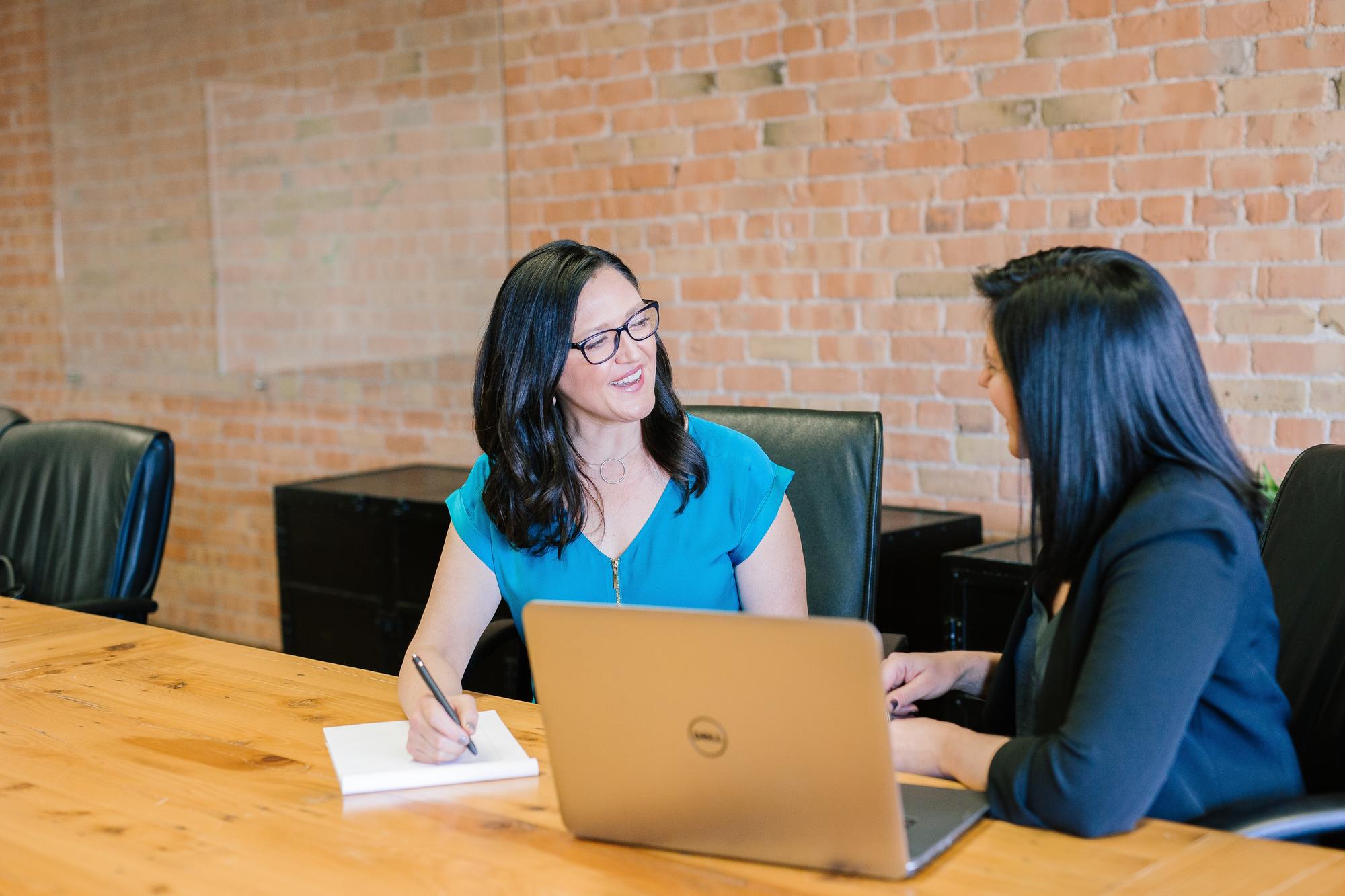 two female students in a meeting