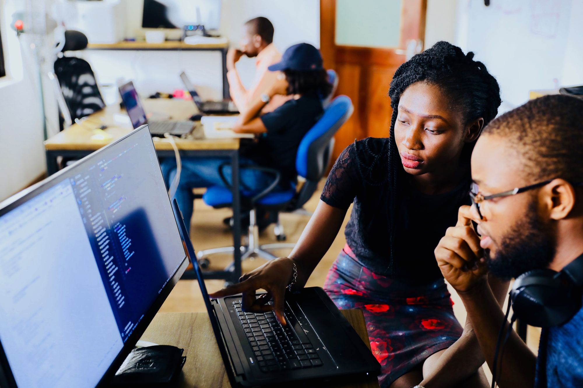 two students looking at a computer