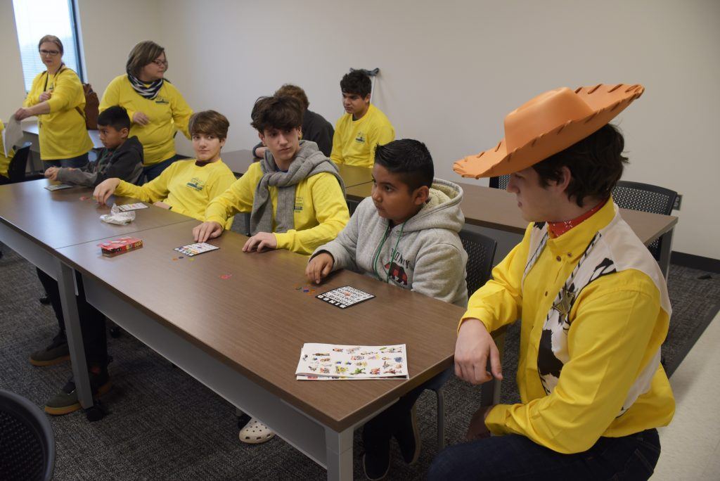 Volunteers from Eagle Ranch entertain kids waiting for teeth cleanings.