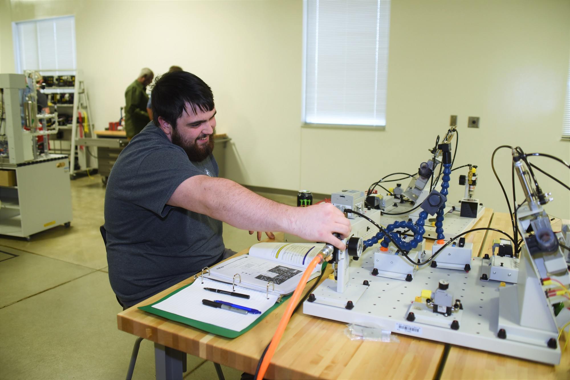 Student working with metal