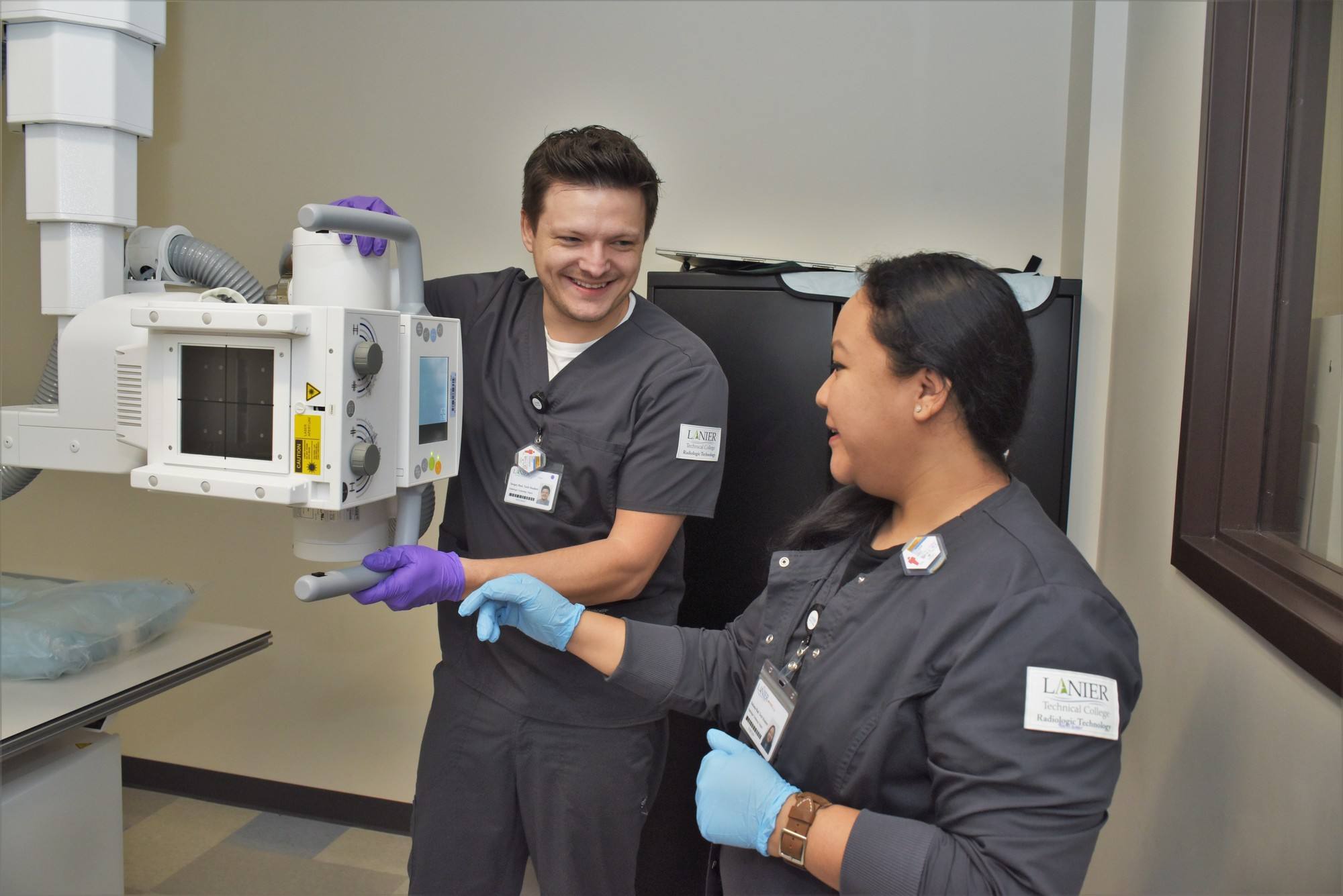 Radiologic Technology students looking at equipment