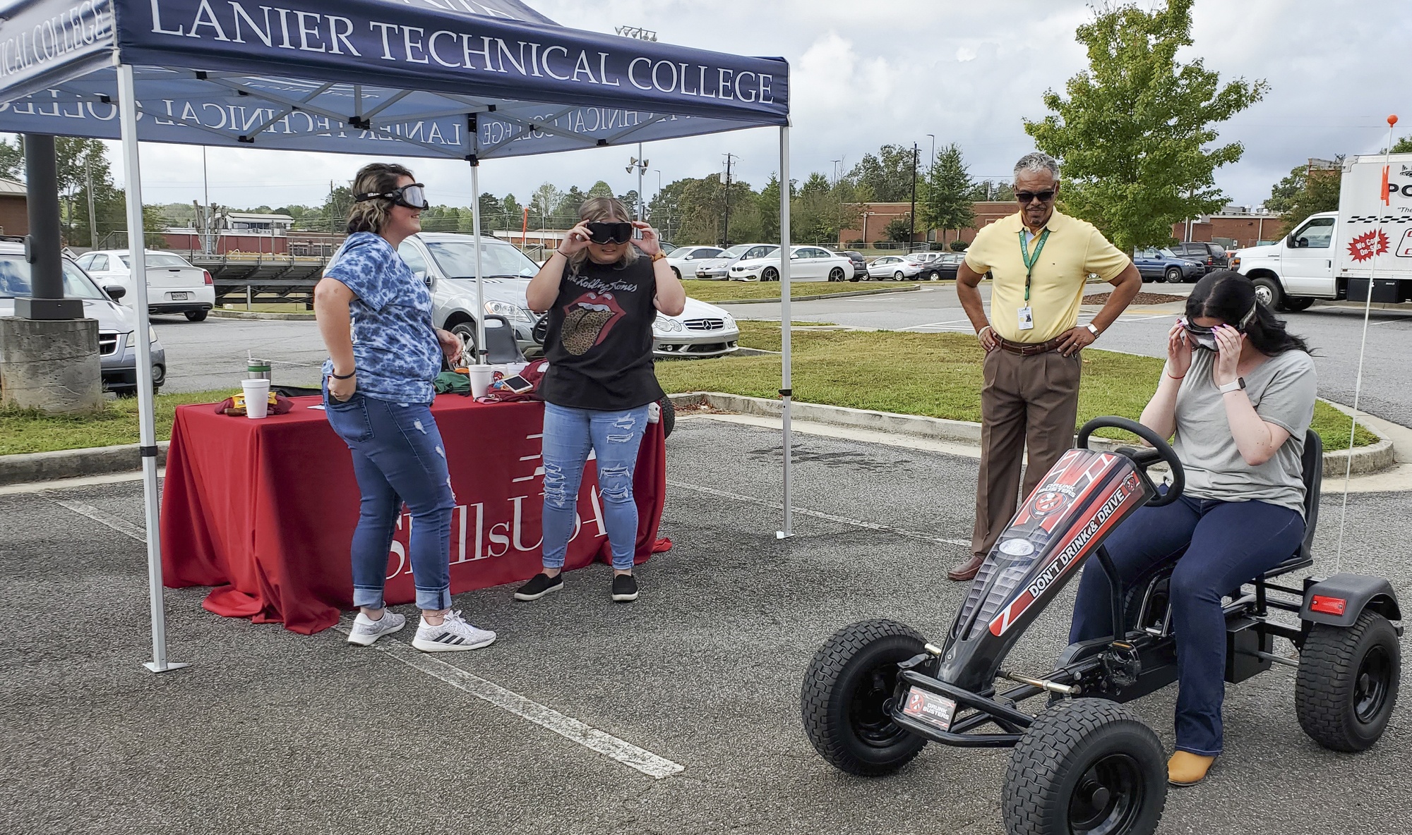 Ken Orr of Lanier Tech watches as an “impaired driver“ gets ready for the course as two       students wait their turns behind the wheel.