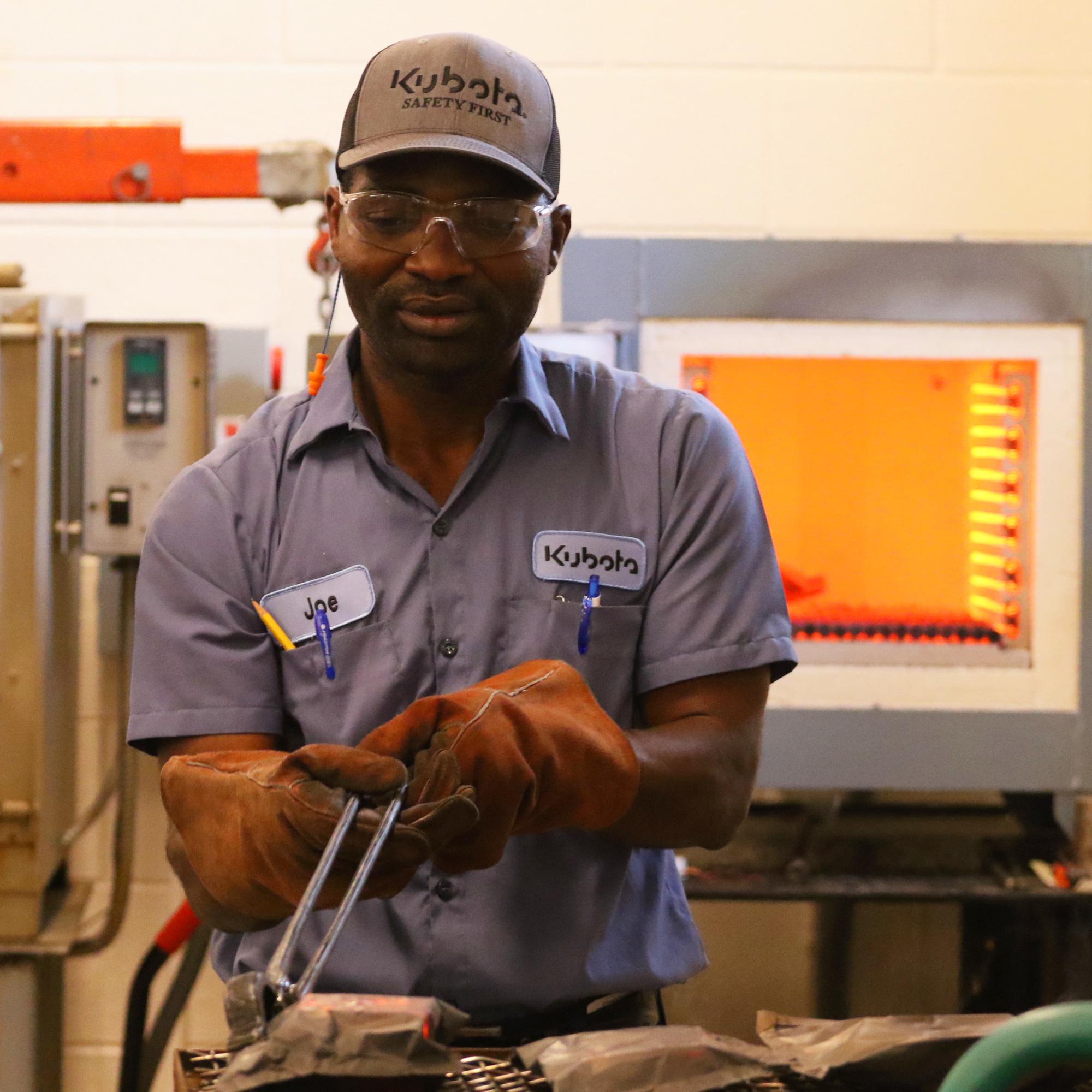 Student working with metal