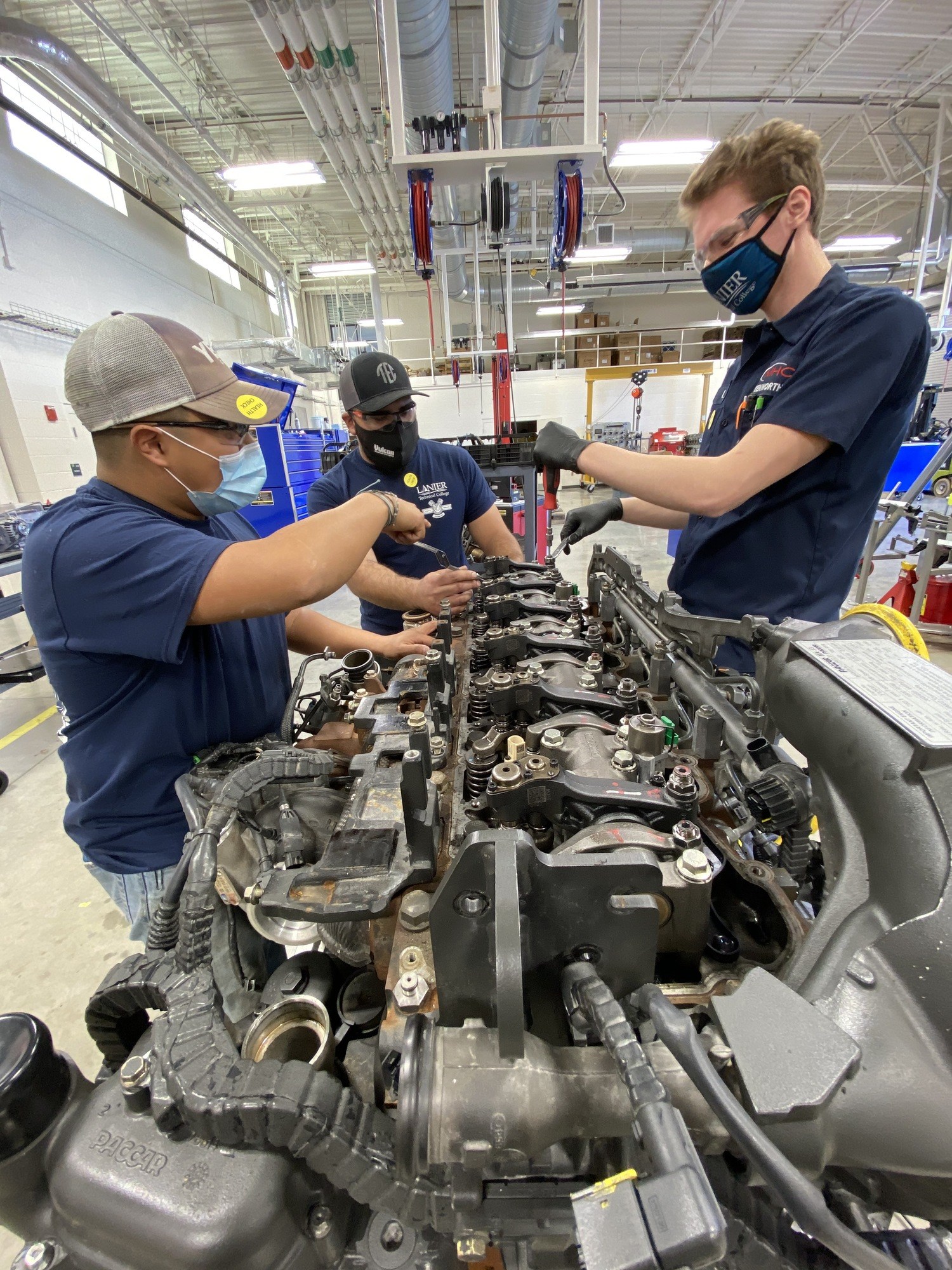 Students from Diesel Equipment Technology Program working on engine