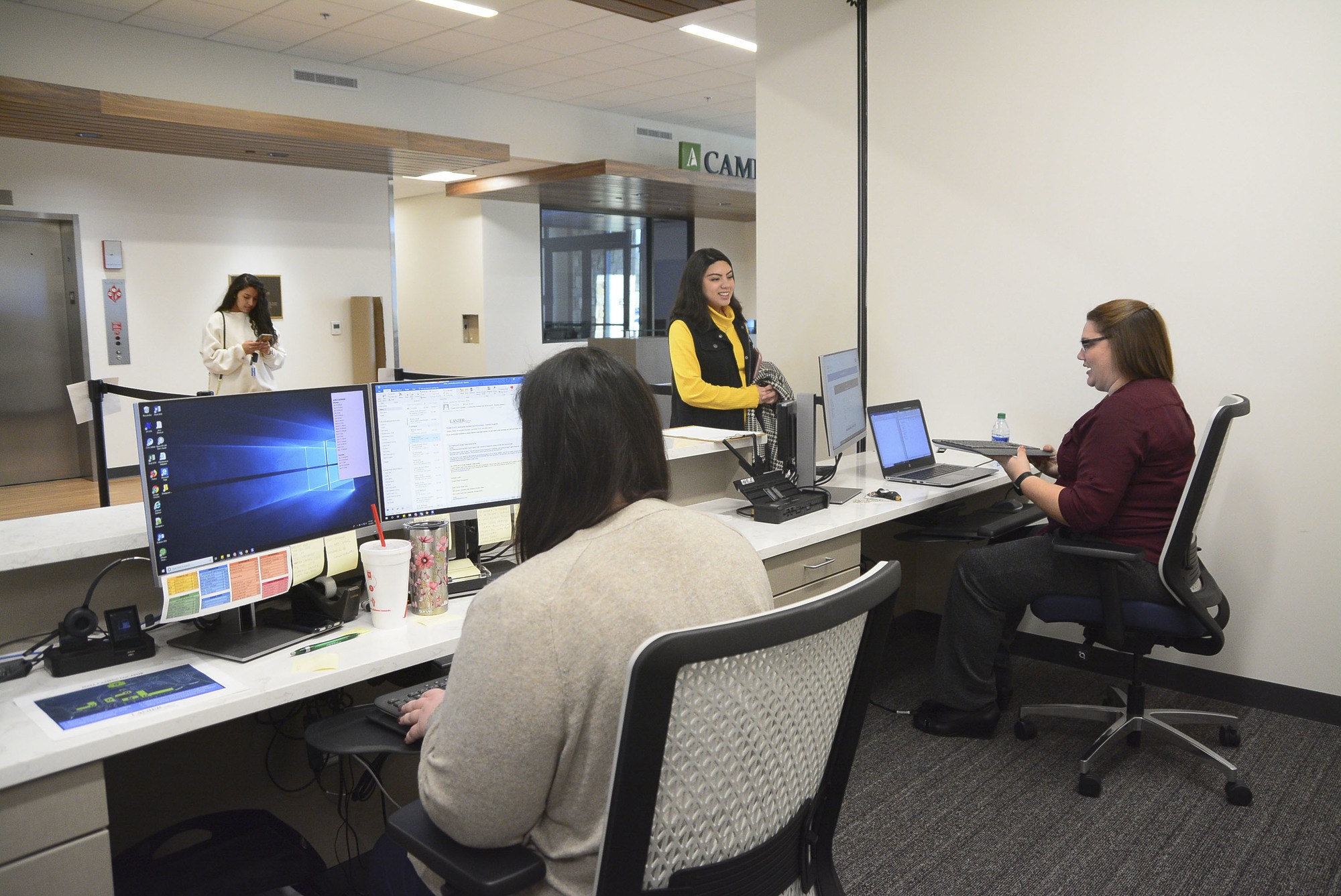 female student receiving assistance at the student affairs reception desk