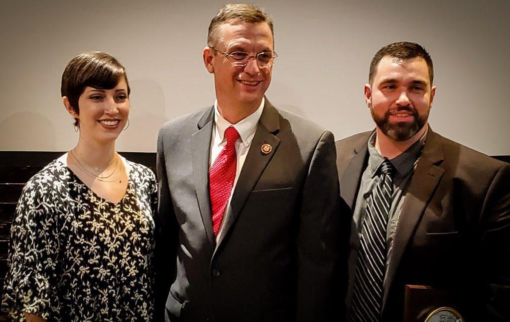 US Representative Doug Collins, presented award, with Susanna and Brandon Carey.