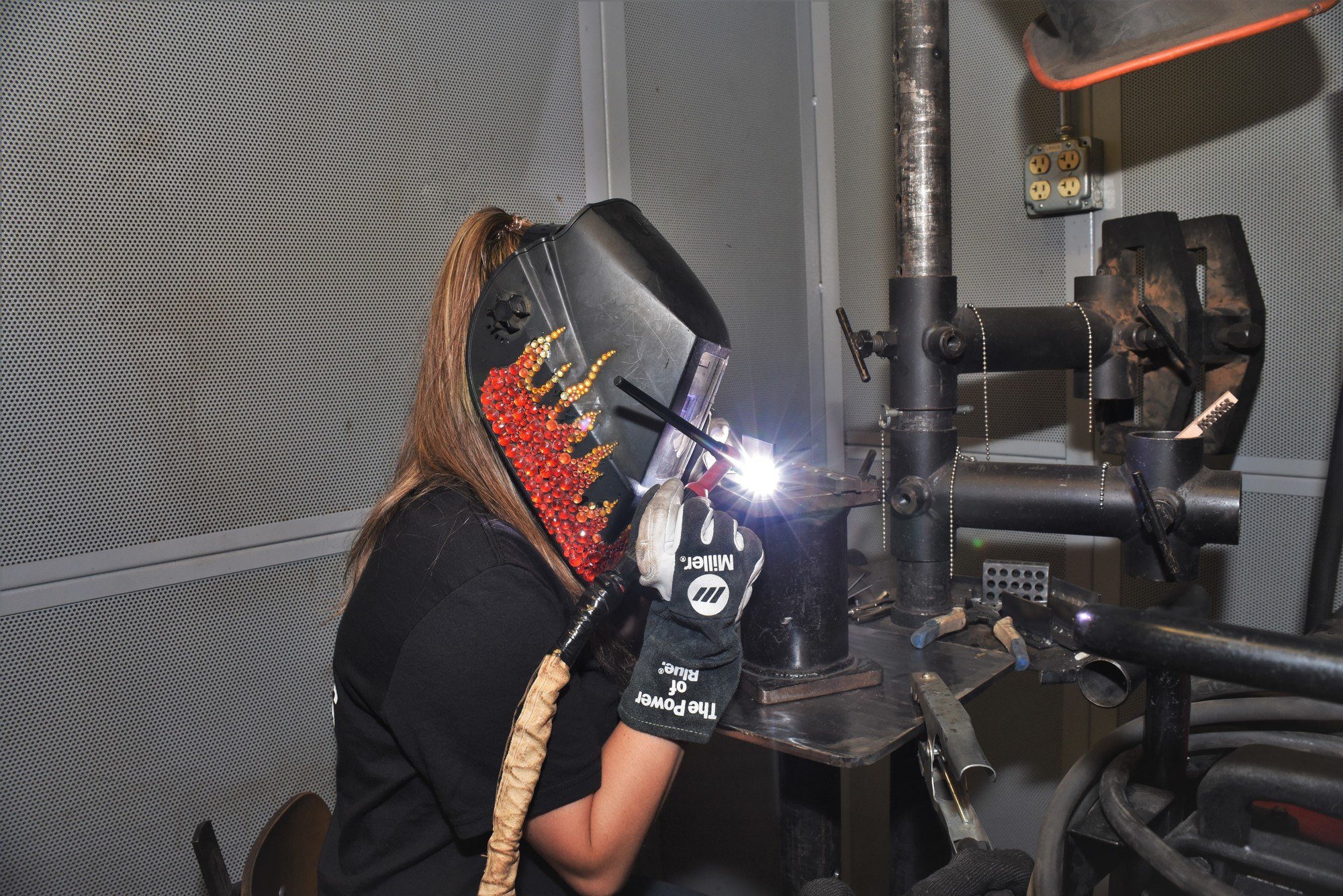 Student working with metal