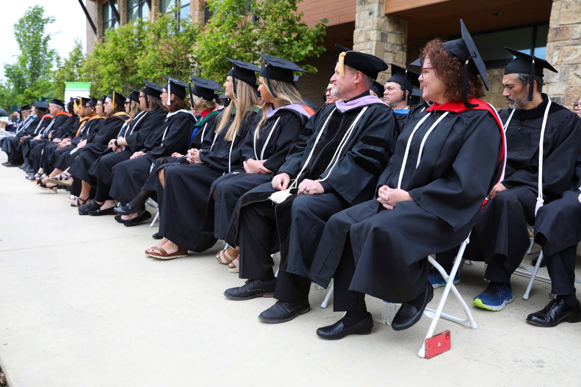 faculty and staff on stage